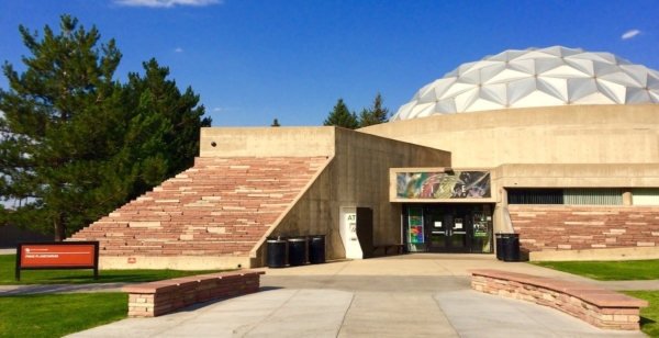 Picture of outside of Fiske auditorium. Showing a domed building and walkway